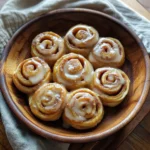 Mexican Tortilla Cinnamon Rolls – The Irresistible Fusion of Tradition and Sweet Delight 5 Mexican tortilla cinnamon rolls on wooden plate
