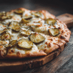 Pickle Pizza with garlic cream sauce and dill pickles