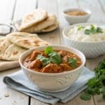 Crockpot Butter Chicken served with rice and naan
