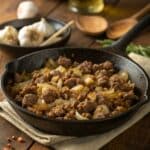 Creamy homemade Hamburger Helper with melted cheddar and parsley in a skillet