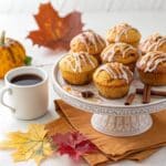 Pumpkin cinnamon roll muffins served with glaze