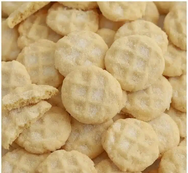 Delicious melt-in-your-mouth sugar cookies arranged on a plate