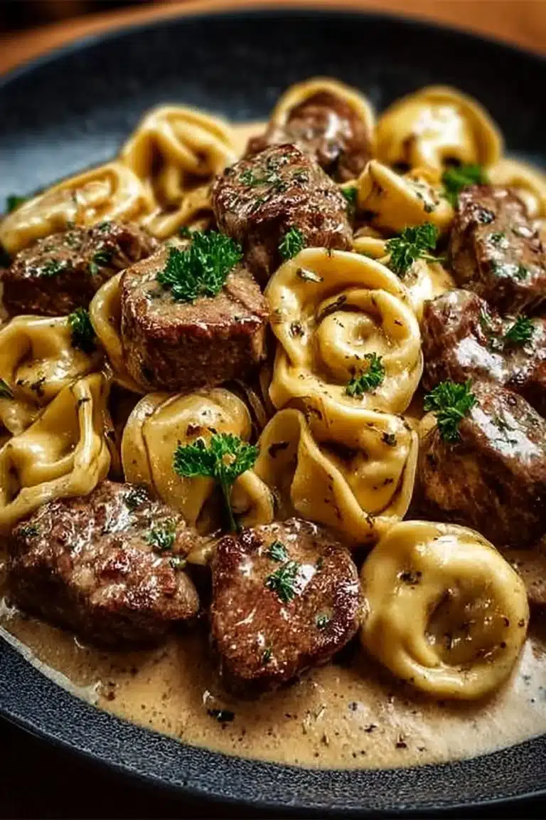 Cracked Garlic Steak Tortellini in Creamhouse Sauce Bliss 2 Cracked Garlic Steak Tortellini served with Creamhouse Sauce on a plate