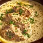 Crock Pot Angel Chicken served on a plate with herbs