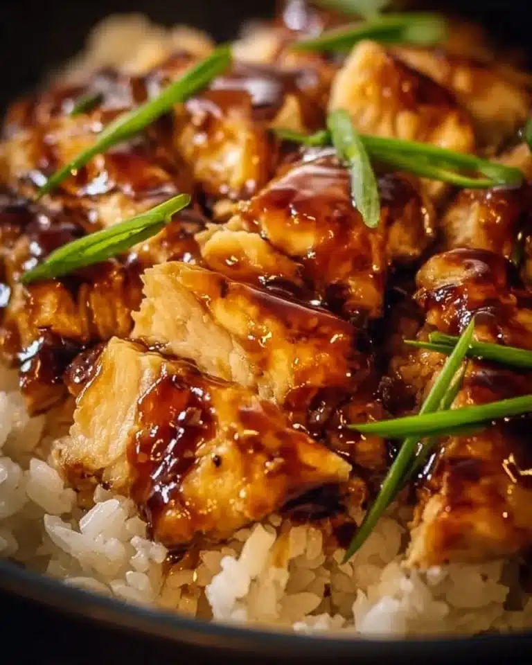 Plate of Honey BBQ Chicken served over fluffy rice with vibrant vegetables