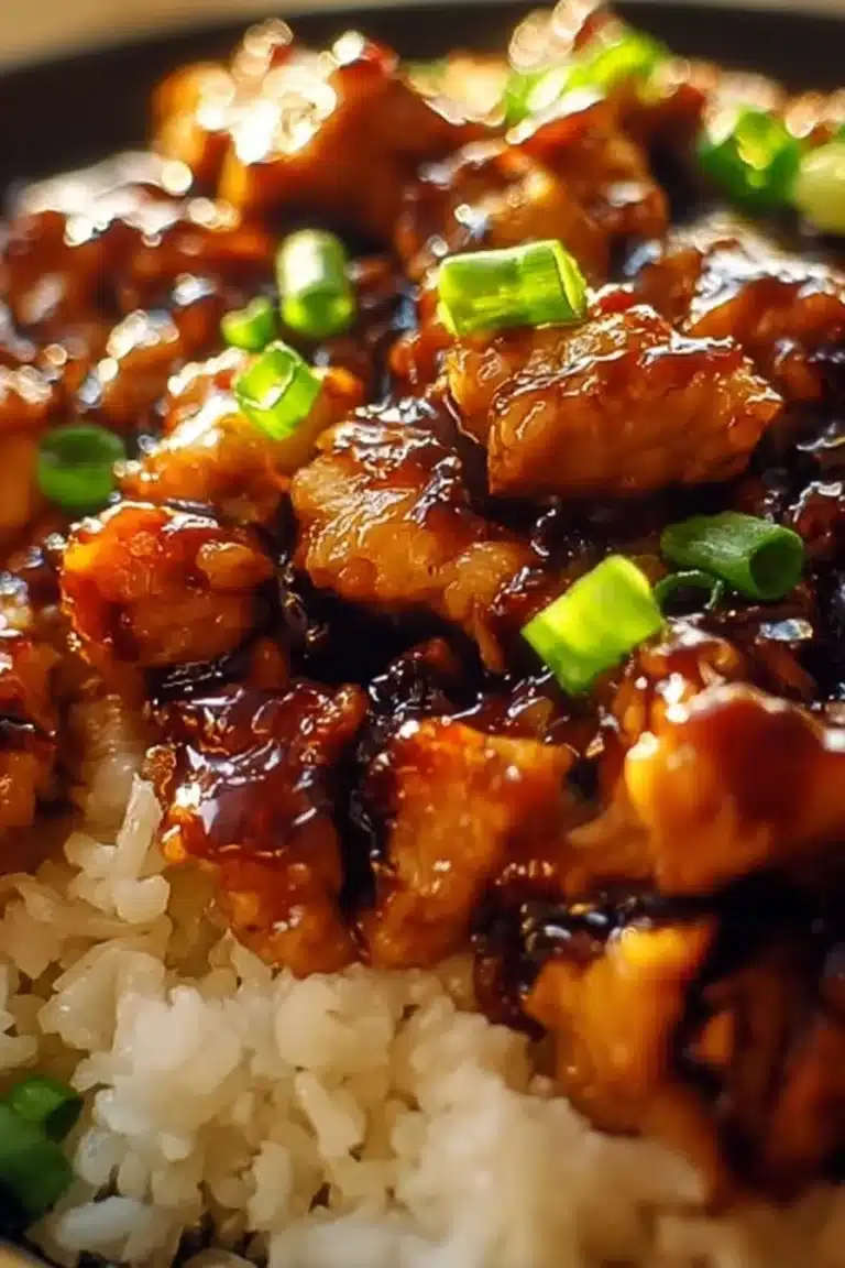 Honey BBQ Chicken served over rice with flavorful sauce and garnishes