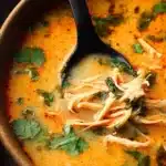 Thai Inspired Chicken Soup 3 Bowl of Thai Inspired Chicken Soup with fresh herbs and vibrant spices