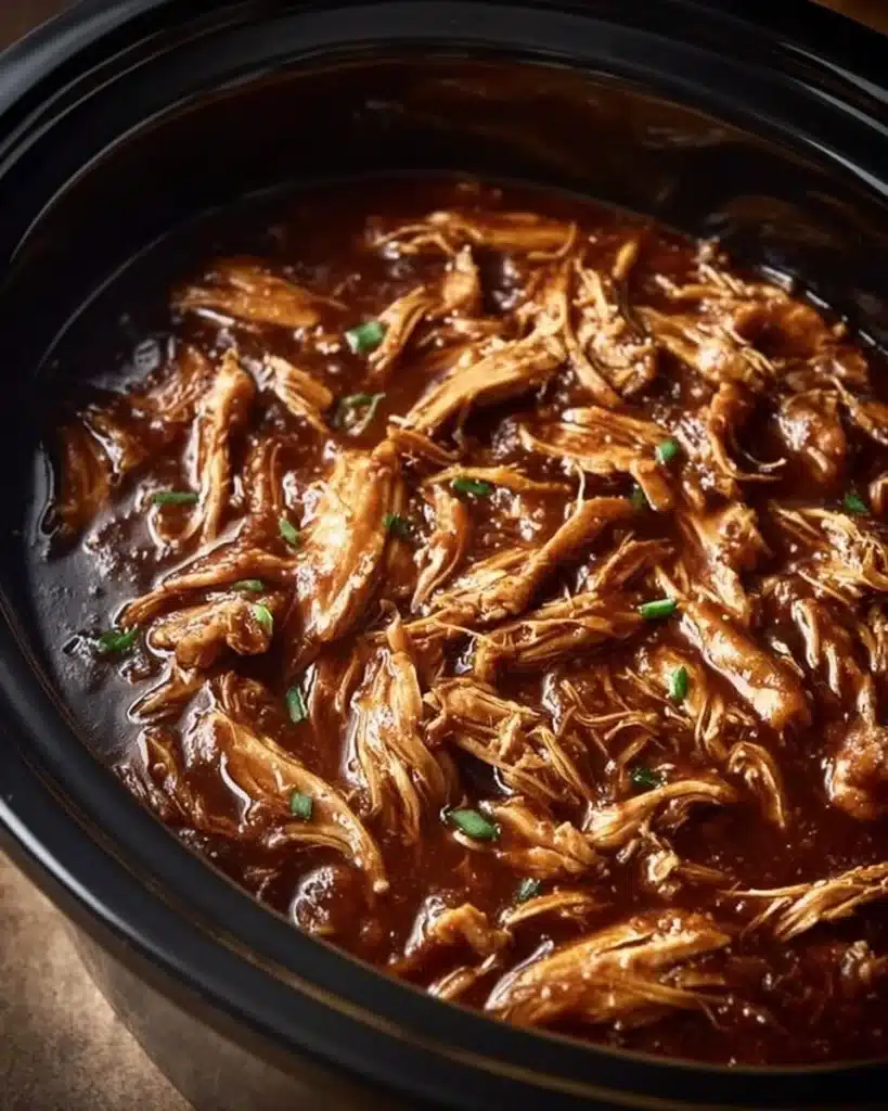 Plate of Bourbon Chicken with sauce and vegetables