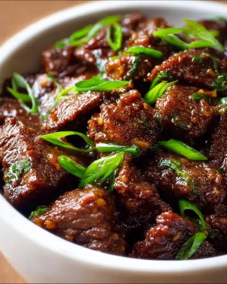 Delicious Slow Cooker Mongolian Beef served with rice and vegetables