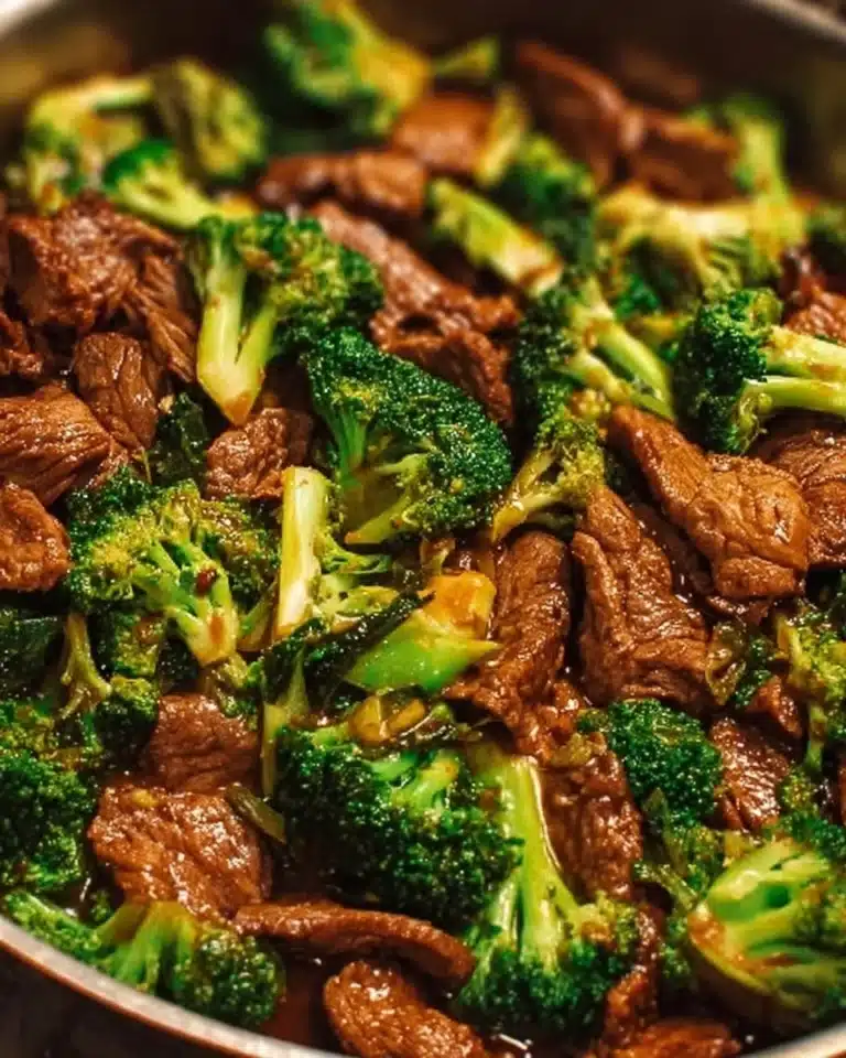 Delicious beef and broccoli stir-fry served on a white plate