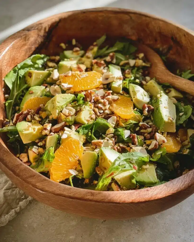 Delicious arugula citrus salad with fresh ingredients in a bowl.